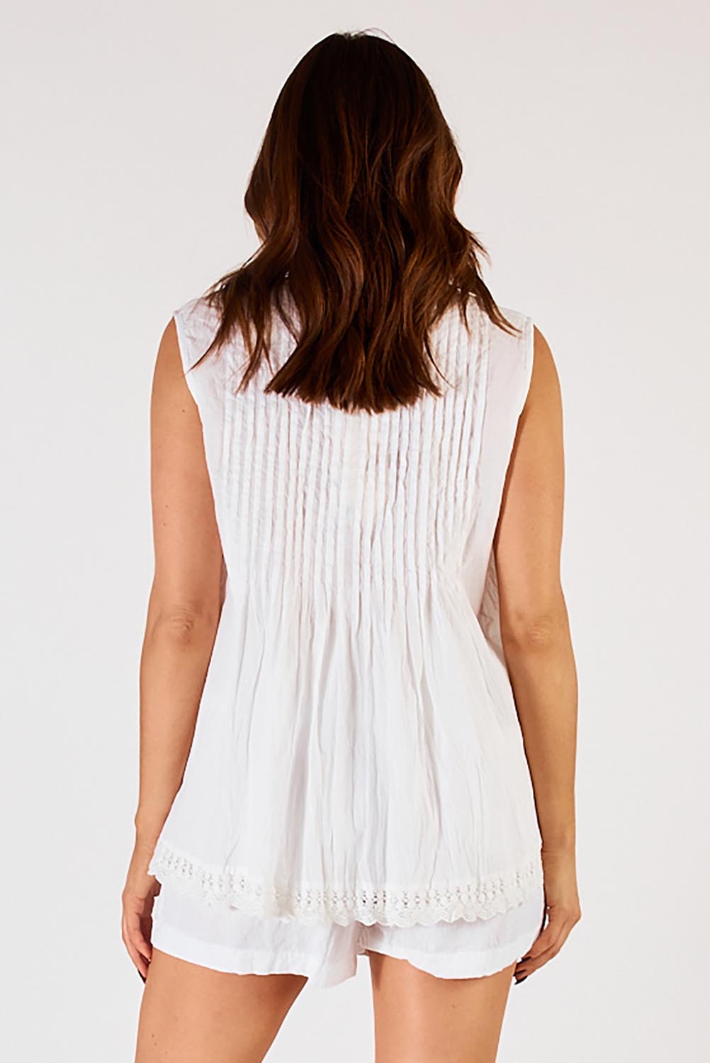 A model wearing the Leila Cotton Tank in colour White (White), from the back