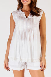 A model wearing the Leila Cotton Tank in colour White (White), from the front, cropped image