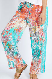 Model Gemma wearing size S of the Lyla Pant in colour Indigo (Blue), from the front, cropped image