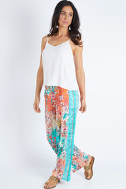 Model Gemma wearing size S of the Lyla Pant in colour Indigo (Blue), from the front, showing the whole outfit