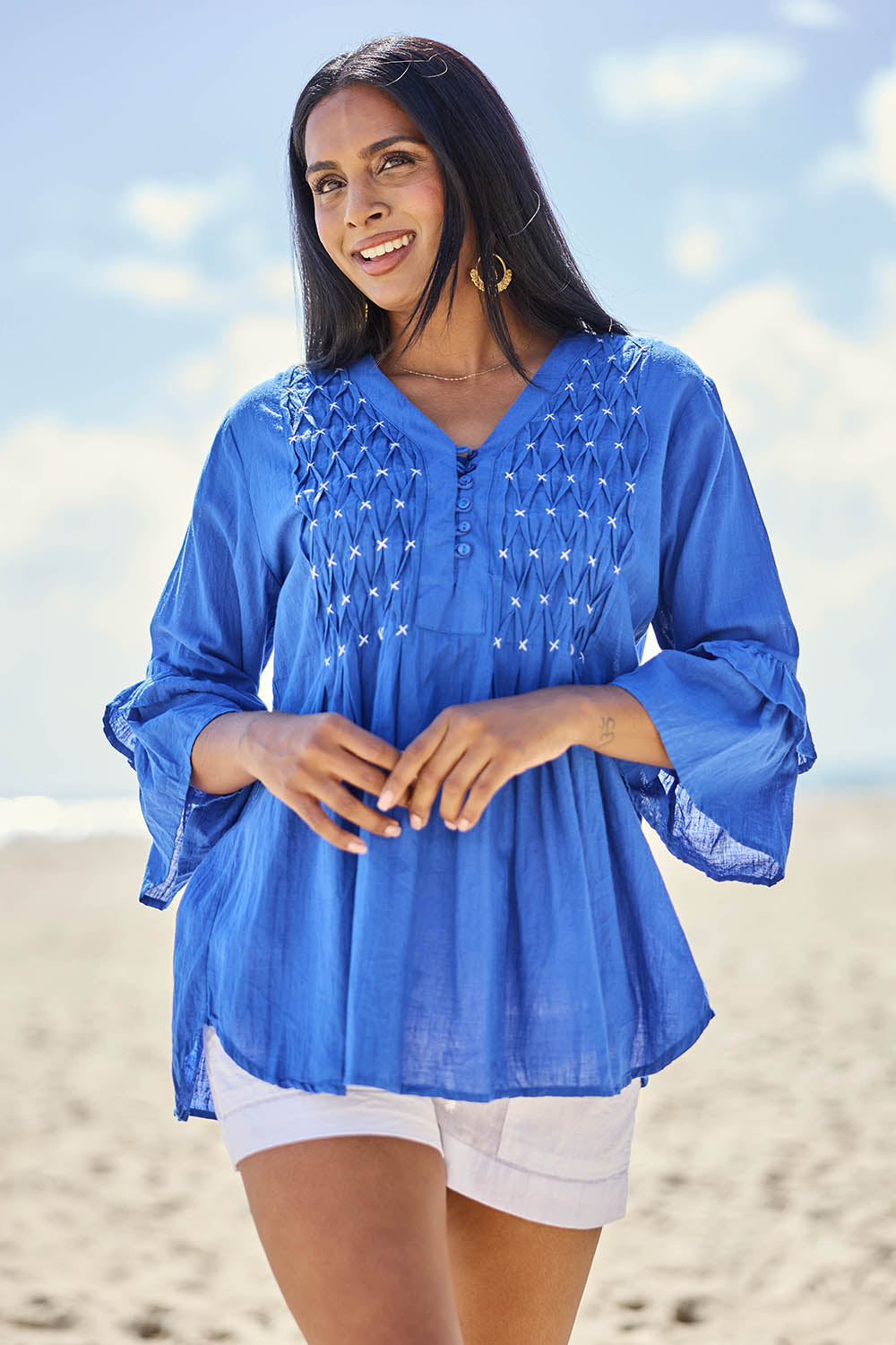 Model Eshan wearing size 10 of the Marilyn Shirt – Azure in colour Azure, in a cropped view