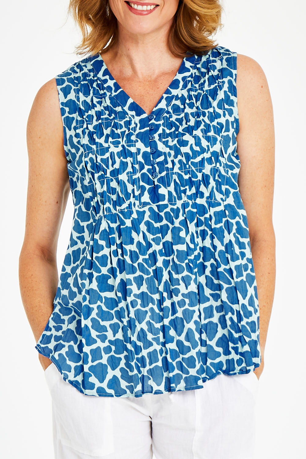 Model Naomi wearing size S of the Marley Top in colour Ocean (Blue), from the front, cropped image