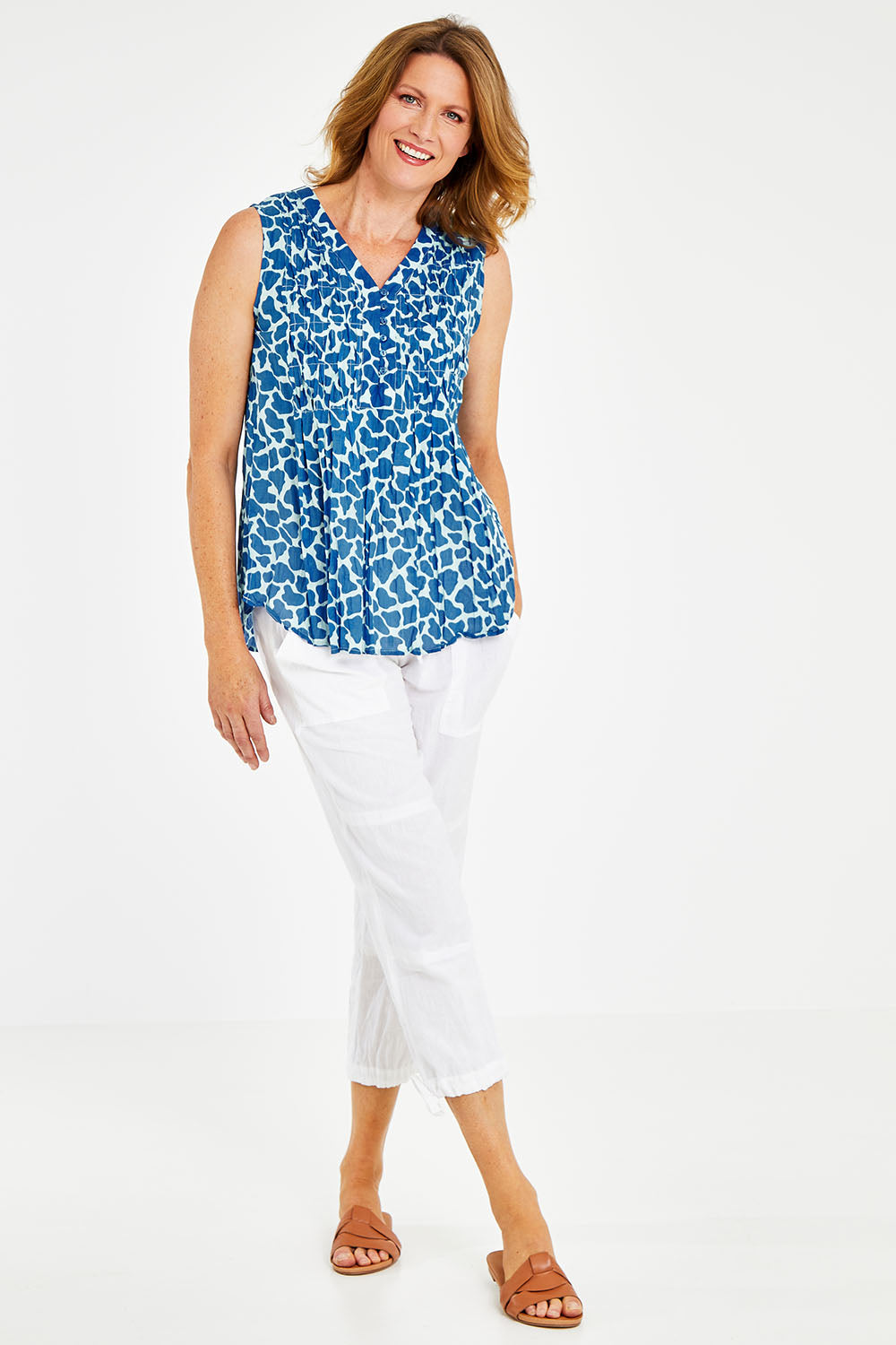 Model Naomi wearing size S of the Marley Top in colour Ocean (Blue), from the front, showing the whole outfit