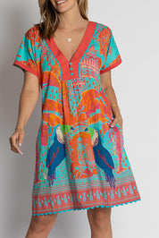 A model wearing the Marquita Cotton Dress in colour Lagoon (Blue), from the front, cropped image