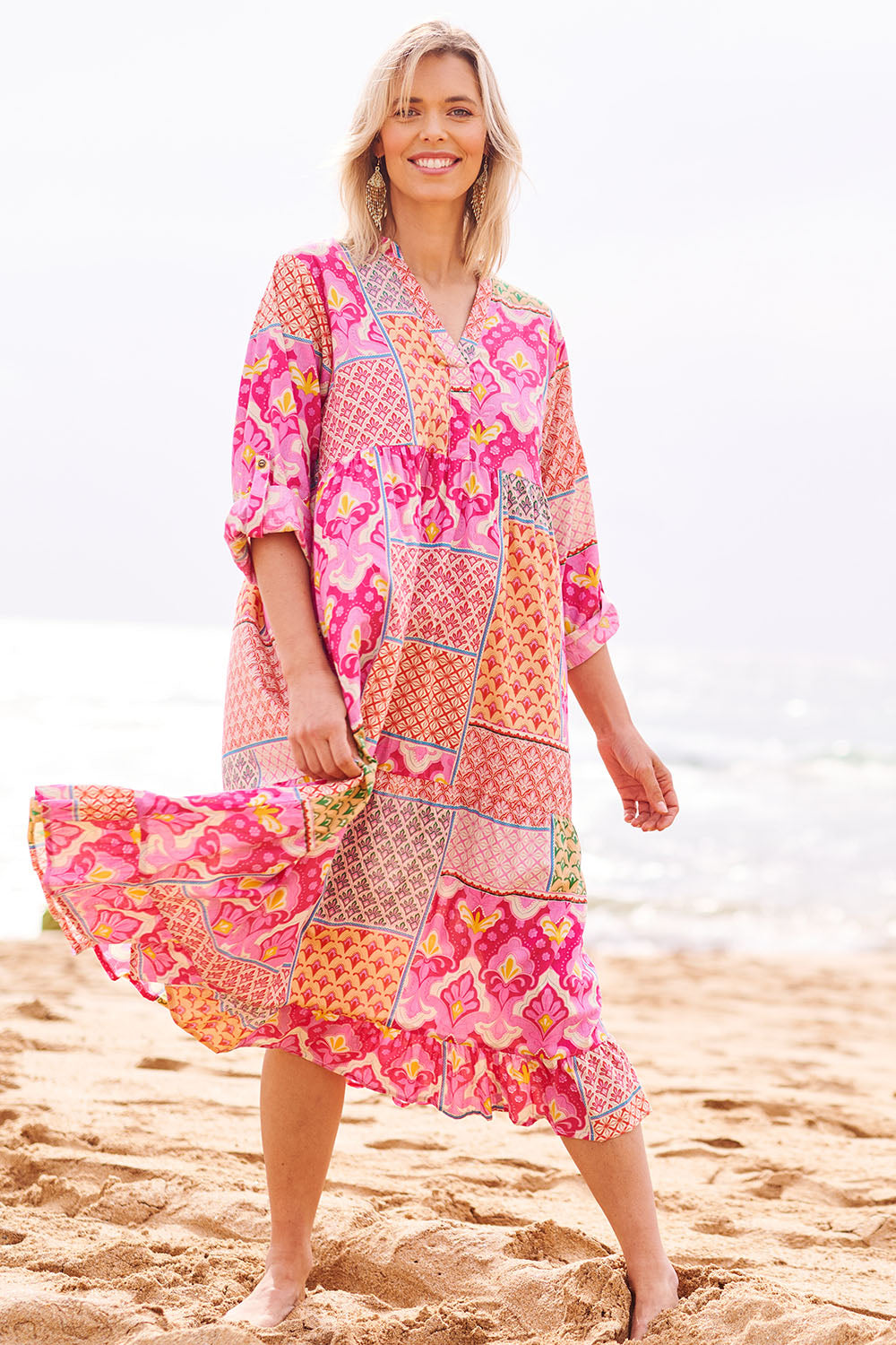 Model Phoebe wearing size S of the Maya Cotton Midi Dress in colour Melon (Pink), from the front, showing the whole outfit