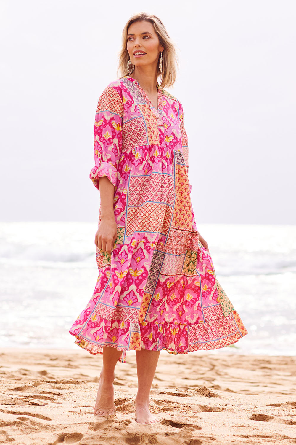 Model Phoebe wearing size S of the Maya Cotton Midi Dress in colour Melon (Pink), from the front, showing the whole outfit
