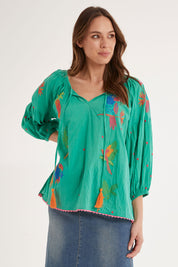 Model Madeline wearing size S of the Mermaid Top in colour Sea (Green), from the front, cropped image