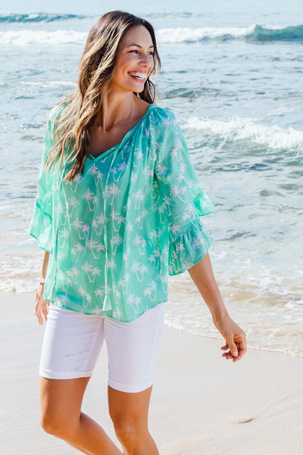 Model Amanda wearing size S of the Miami Top in colour Surf (Green), from the front, showing the whole outfit