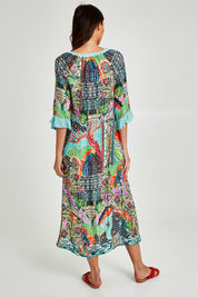 Model Madeline wearing size S of the Mosaic Maxi Dress in colour Print (Blue), from the back
