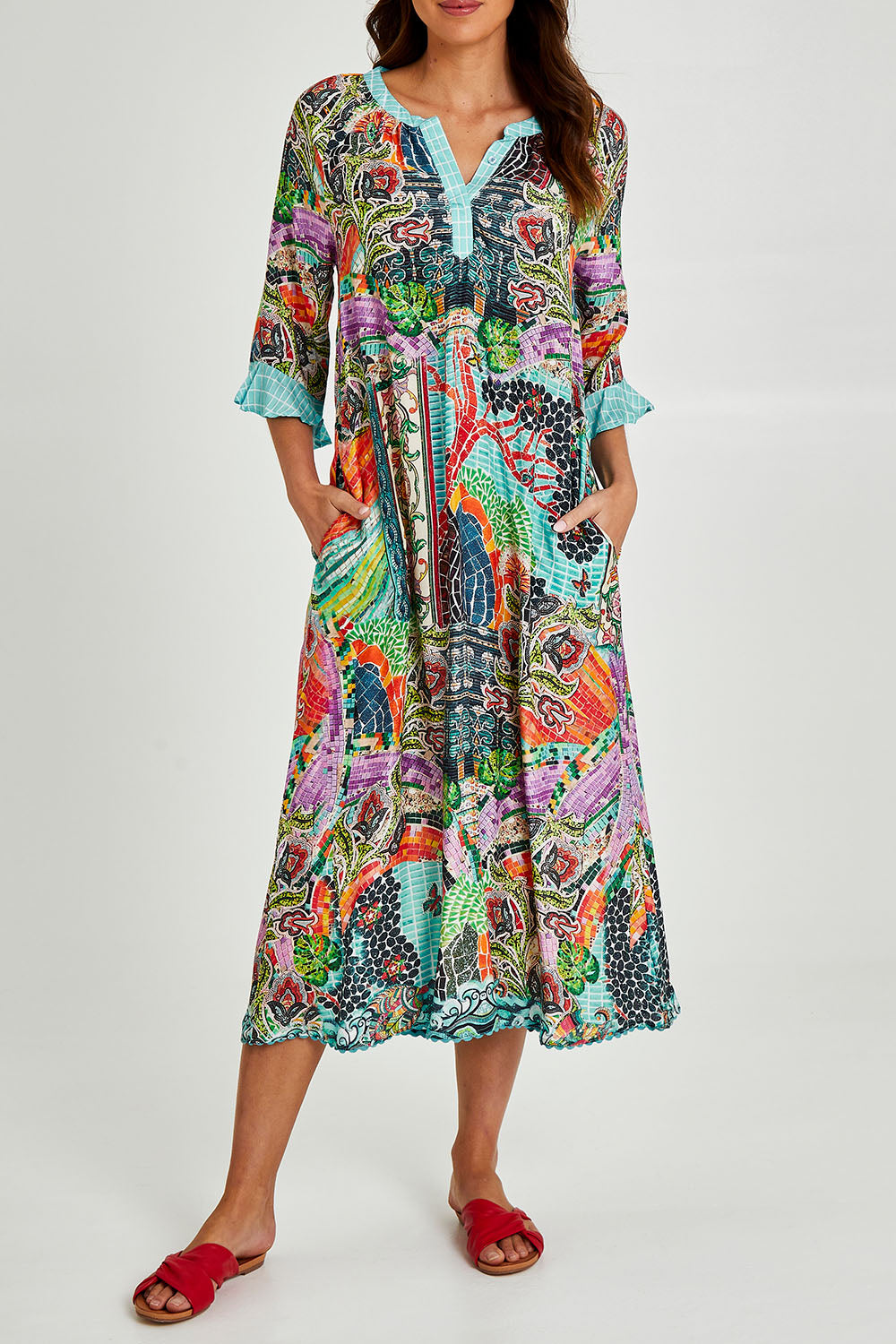 Model Madeline wearing size S of the Mosaic Maxi Dress in colour Print (Blue), from the front, cropped image