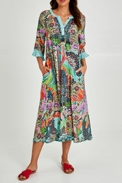 Model Madeline wearing size S of the Mosaic Maxi Dress in colour Print (Blue), from the front, cropped image