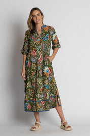 A model wearing the Nandita Cotton Midi Dress in colour Olive (Green), from the front, showing the whole outfit