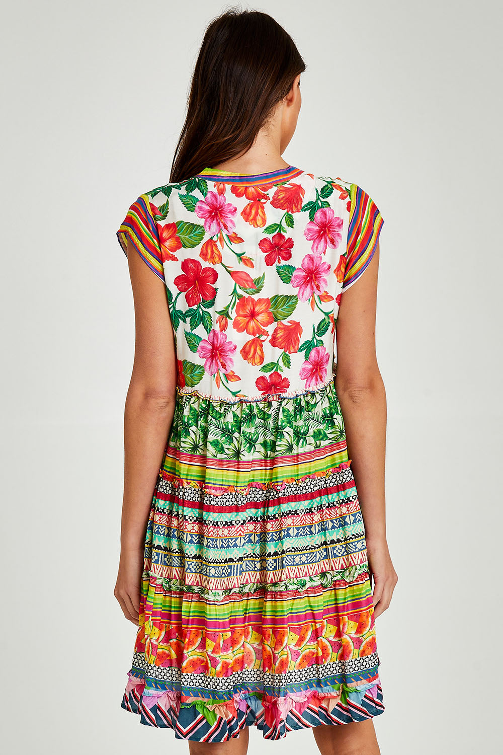 Model Madeline wearing size S of the Palmer Tiered Dress in colour Print (Green), from the back