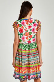 Model Madeline wearing size S of the Palmer Tiered Dress in colour Print (Green), from the back