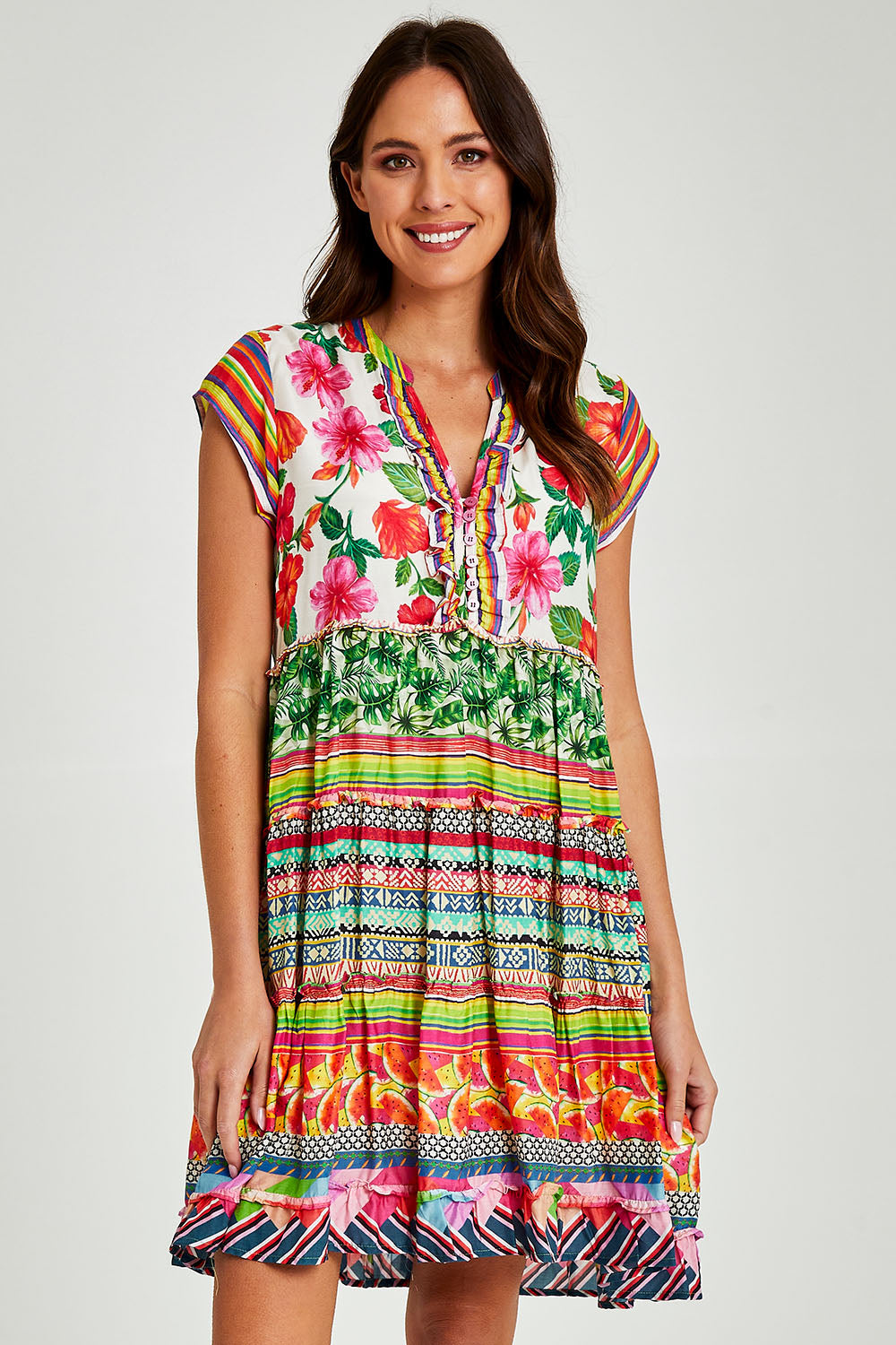 Model Madeline wearing size S of the Palmer Tiered Dress in colour Print (Green), from the front, cropped image