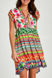 Model Madeline wearing size S of the Palmer Tiered Dress in colour Print (Green), from the front, cropped image