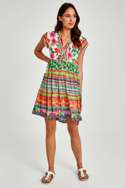 Model Madeline wearing size S of the Palmer Tiered Dress in colour Print (Green), from the front, showing the whole outfit