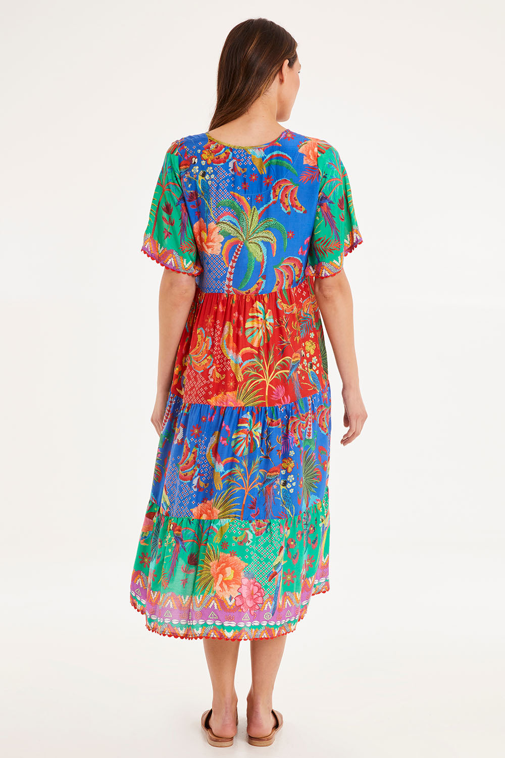 Model Madeline wearing size S of the Peregian Tiered Midi Dress in colour Multi (Blue), from the back