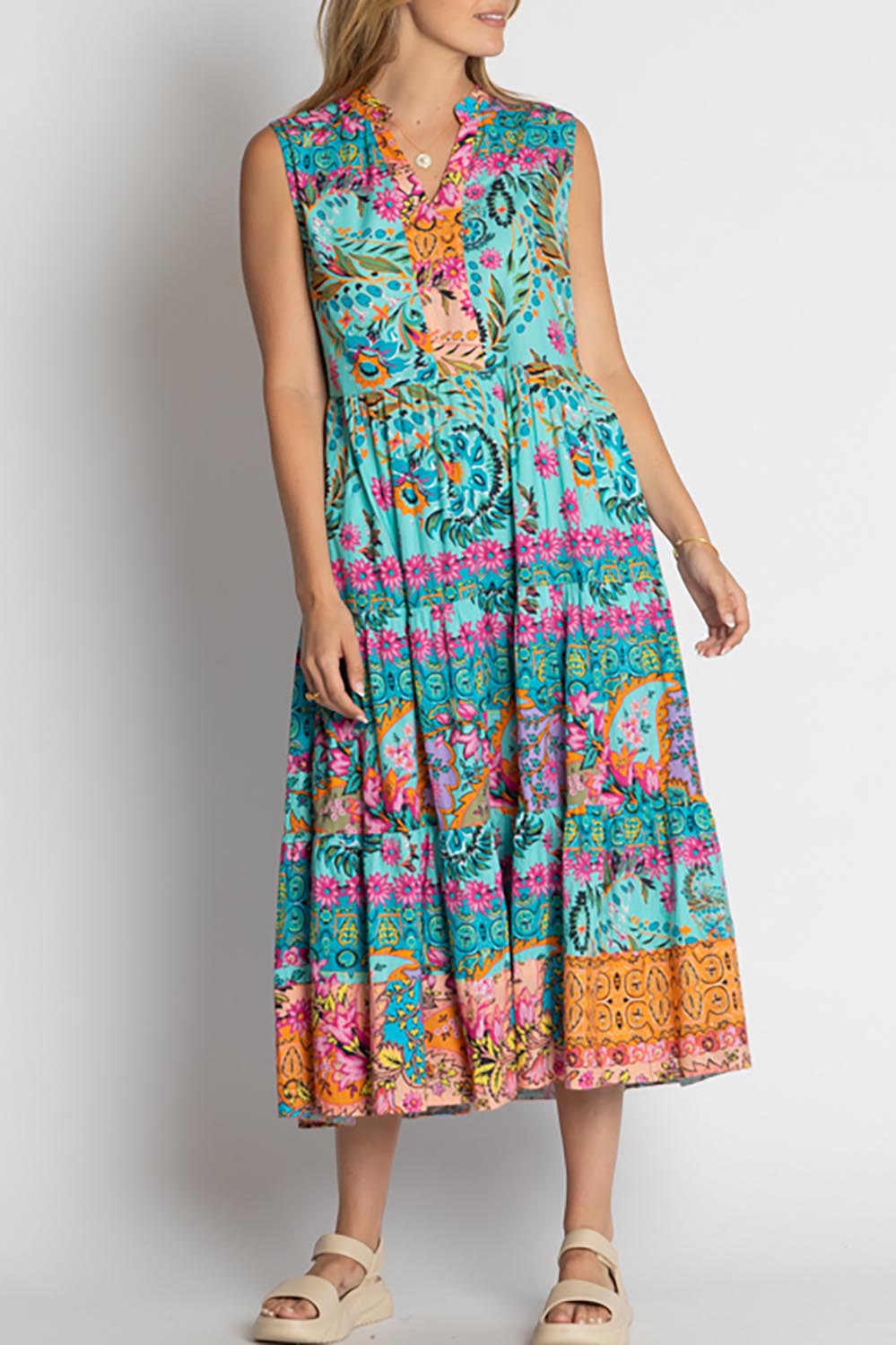 A model wearing the Ratana Cotton Midi Dress in colour Lagoon (Blue), from the front, cropped image
