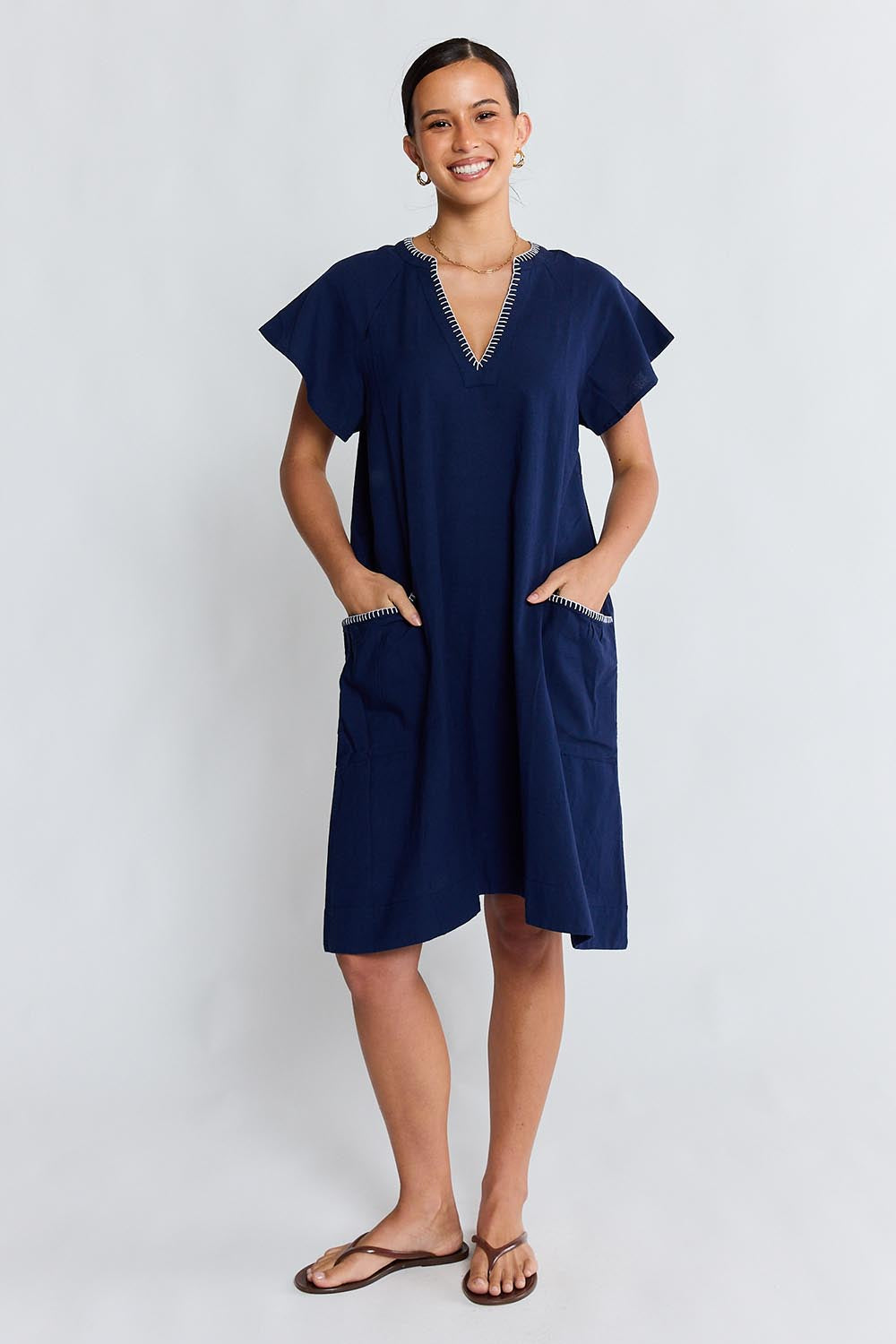 Model Genericm wearing size sample of the Remi Dress – Navy in colour Navy, from the front