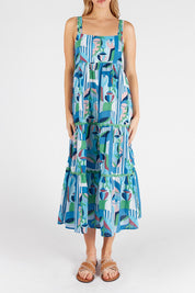 A model wearing the Rosalie Cotton Sundress in colour Sky (Blue), from the front, cropped image