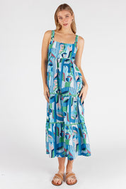 A model wearing the Rosalie Cotton Sundress in colour Sky (Blue), from the front, showing the whole outfit