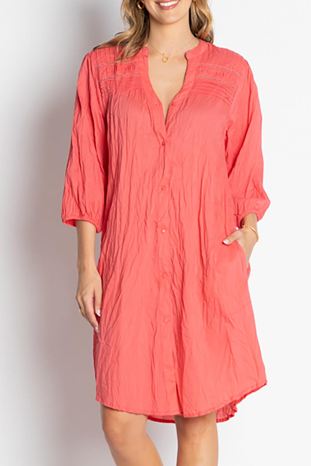 A model wearing the Shayna Cotton Button Dress in colour Geranium (Pink), from the front, cropped image