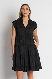 A model wearing the Shayna Cotton Tiered Dress in colour Black (Black), from the front, cropped image