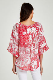 Model Madeline wearing size S of the Tahiti Top in colour Red (Red), from the back
