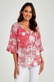Model Madeline wearing size S of the Tahiti Top in colour Red (Red), from the front, cropped image
