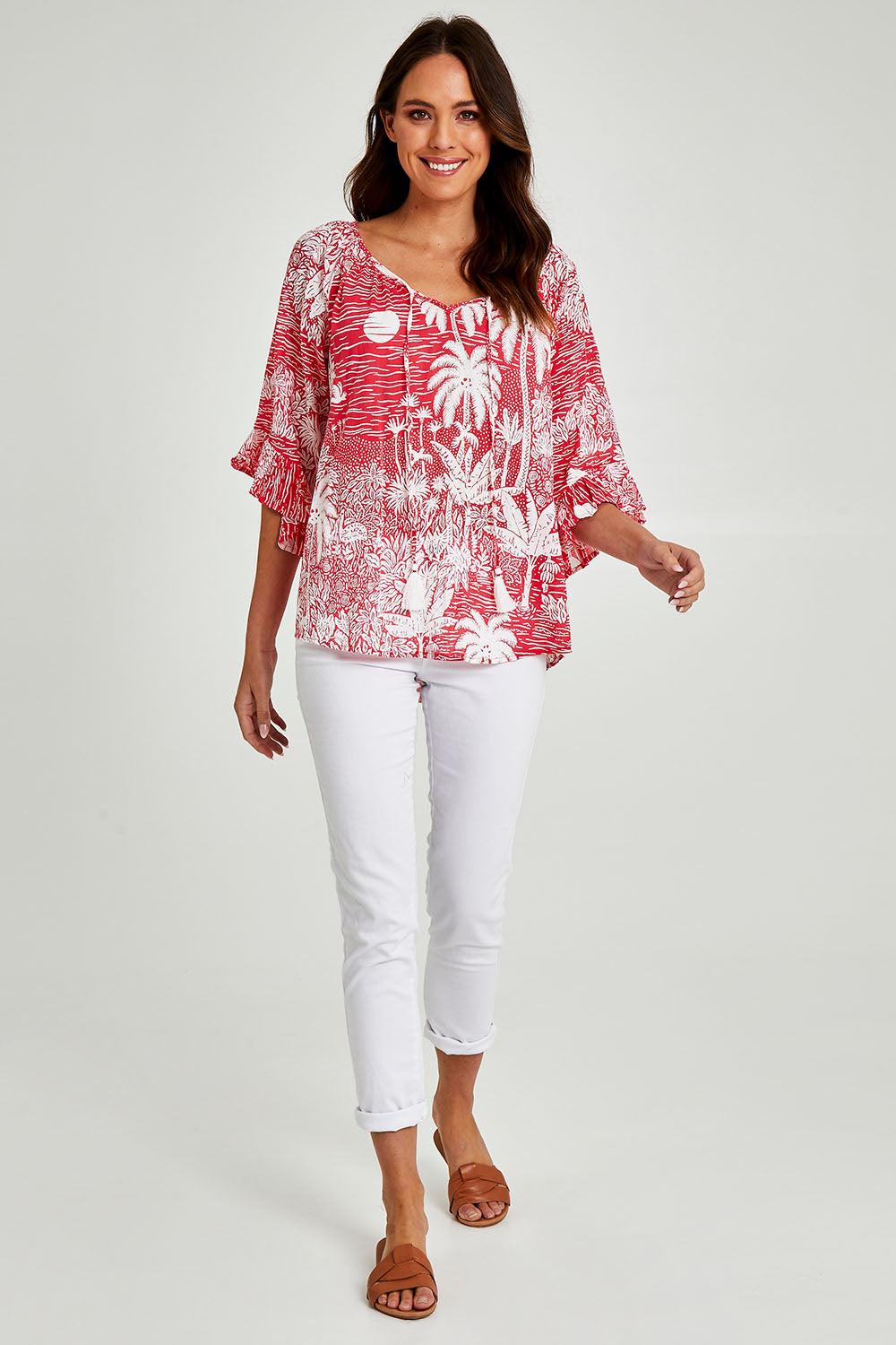 Model Madeline wearing size S of the Tahiti Top in colour Red (Red), from the front, showing the whole outfit