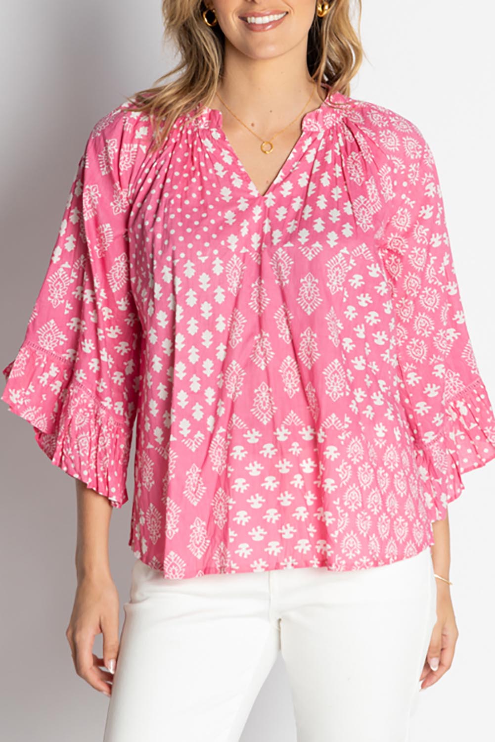 A model wearing the Talei Cotton Top in colour Musk (Pink), from the front, cropped image