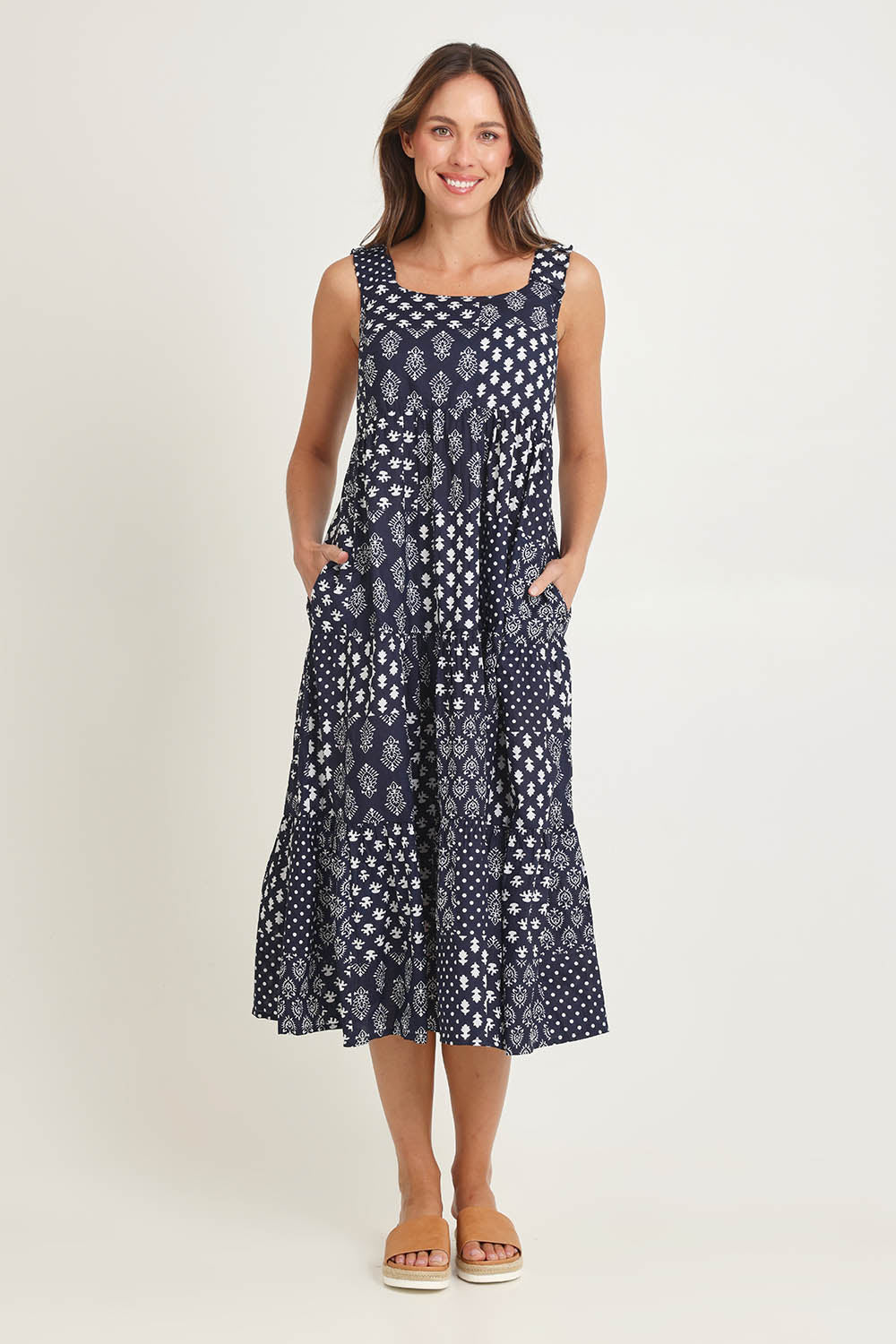 Model Madeline wearing size S of the Talei Cotton Sundress in colour Navy (Blue), from the front, showing the whole outfit
