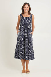 Model Madeline wearing size S of the Talei Cotton Sundress in colour Navy (Blue), from the front, showing the whole outfit