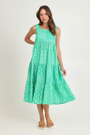 Model Madeline wearing size S of the Talei Cotton Sundress in colour Sea (Green), from the front, showing the whole outfit