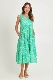 Model Madeline wearing size S of the Talei Cotton Sundress in colour Sea (Green), from the front, showing the whole outfit