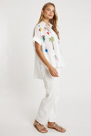 A model wearing the Tillie Cotton Shirt in colour White (White), from the front, showing the whole outfit