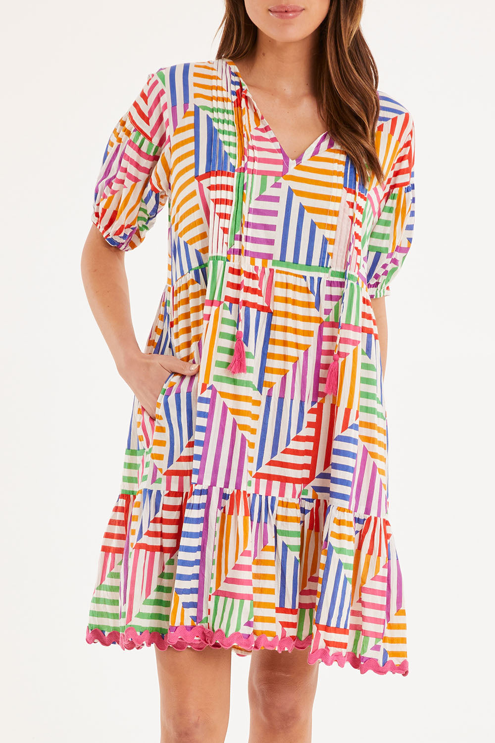 Model Madeline wearing size S of the Torquay Dress in colour Print (Pink), from the front, cropped image