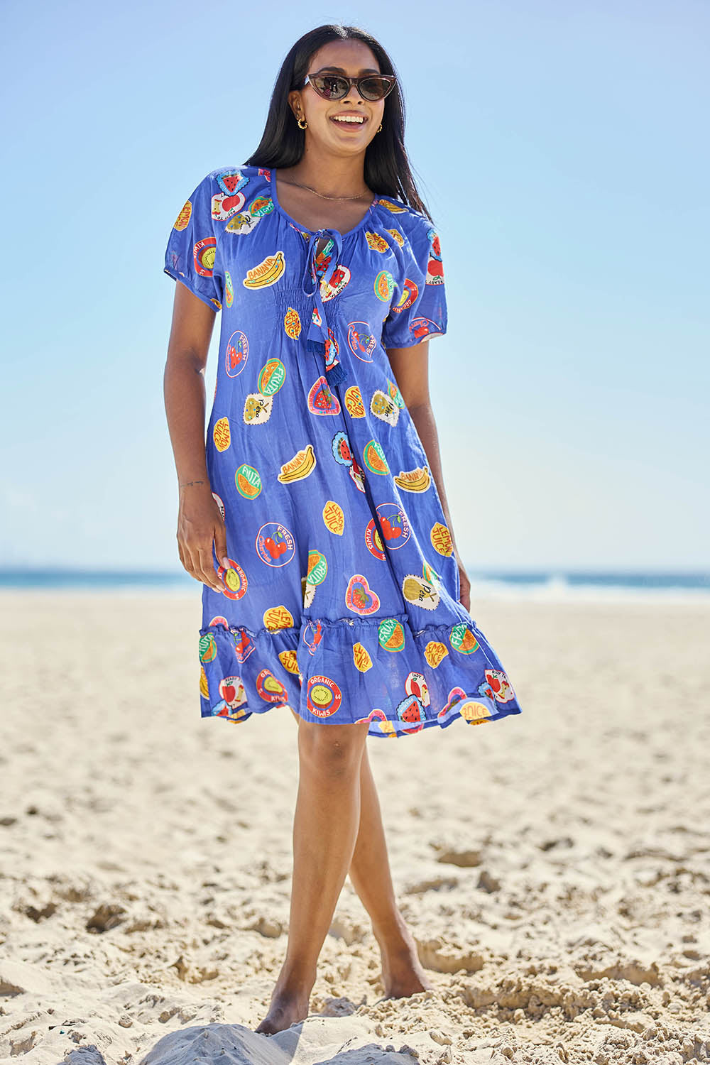 Model Eshan wearing size 10 of the Tutti Fruiti Dress – Ocean in colour Ocean, from the front