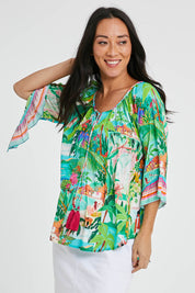 Model Katie wearing size S of the Vacation Top in colour Print (Green), from the front, cropped image