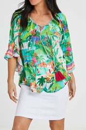Model Katie wearing size S of the Vacation Top in colour Print (Green), from the front, cropped image