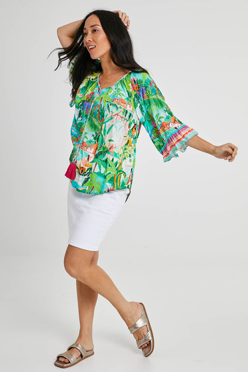 Model Katie wearing size S of the Vacation Top in colour Print (Green), from the front, showing the whole outfit