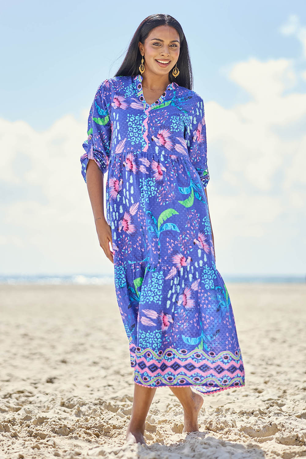 Model Eshan wearing size 10 of the Yasmin Midi Dress – Ocean in colour Ocean, from the front