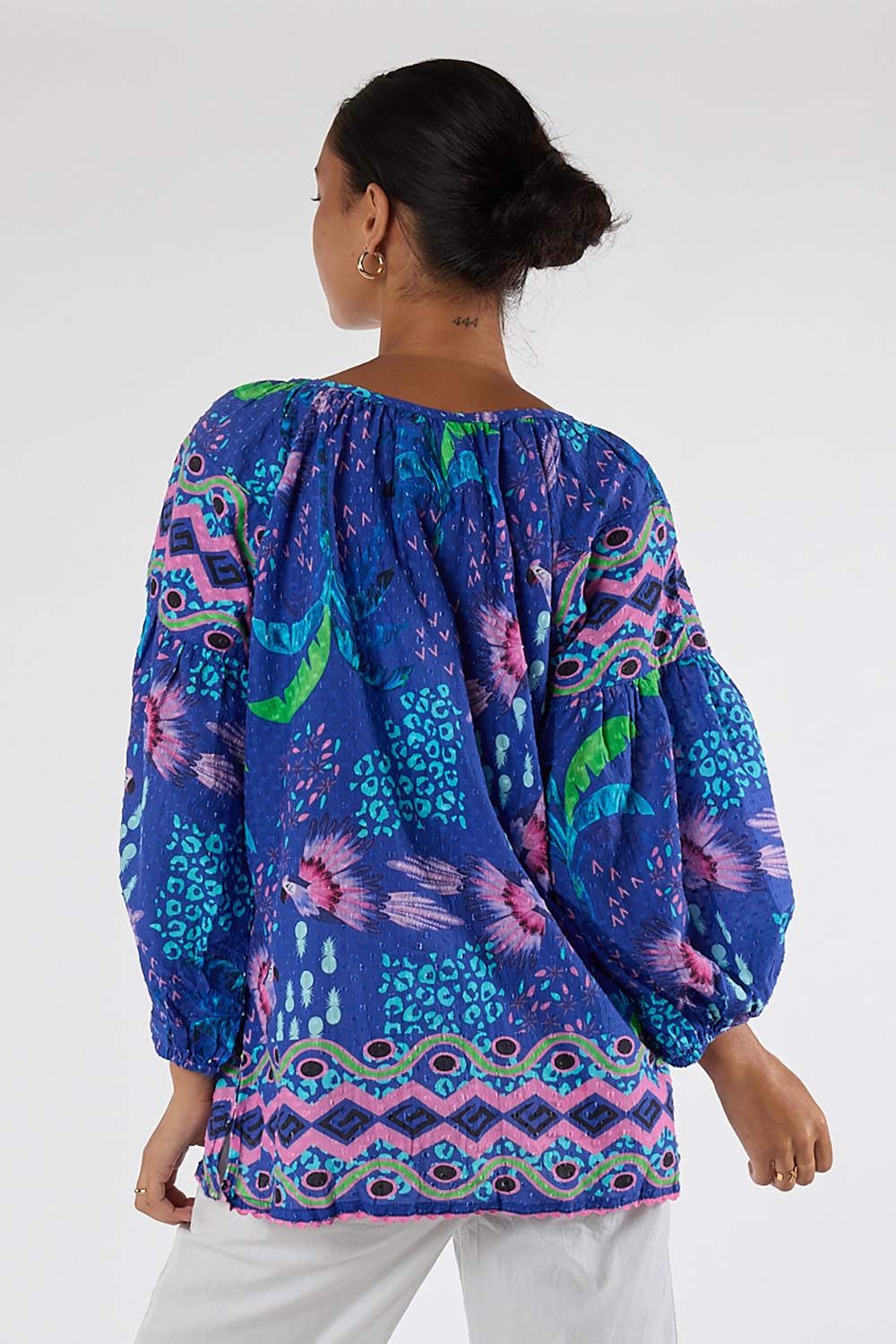 Model Genericm wearing size sample of the Yasmin Top – Ocean in colour Ocean, from the back