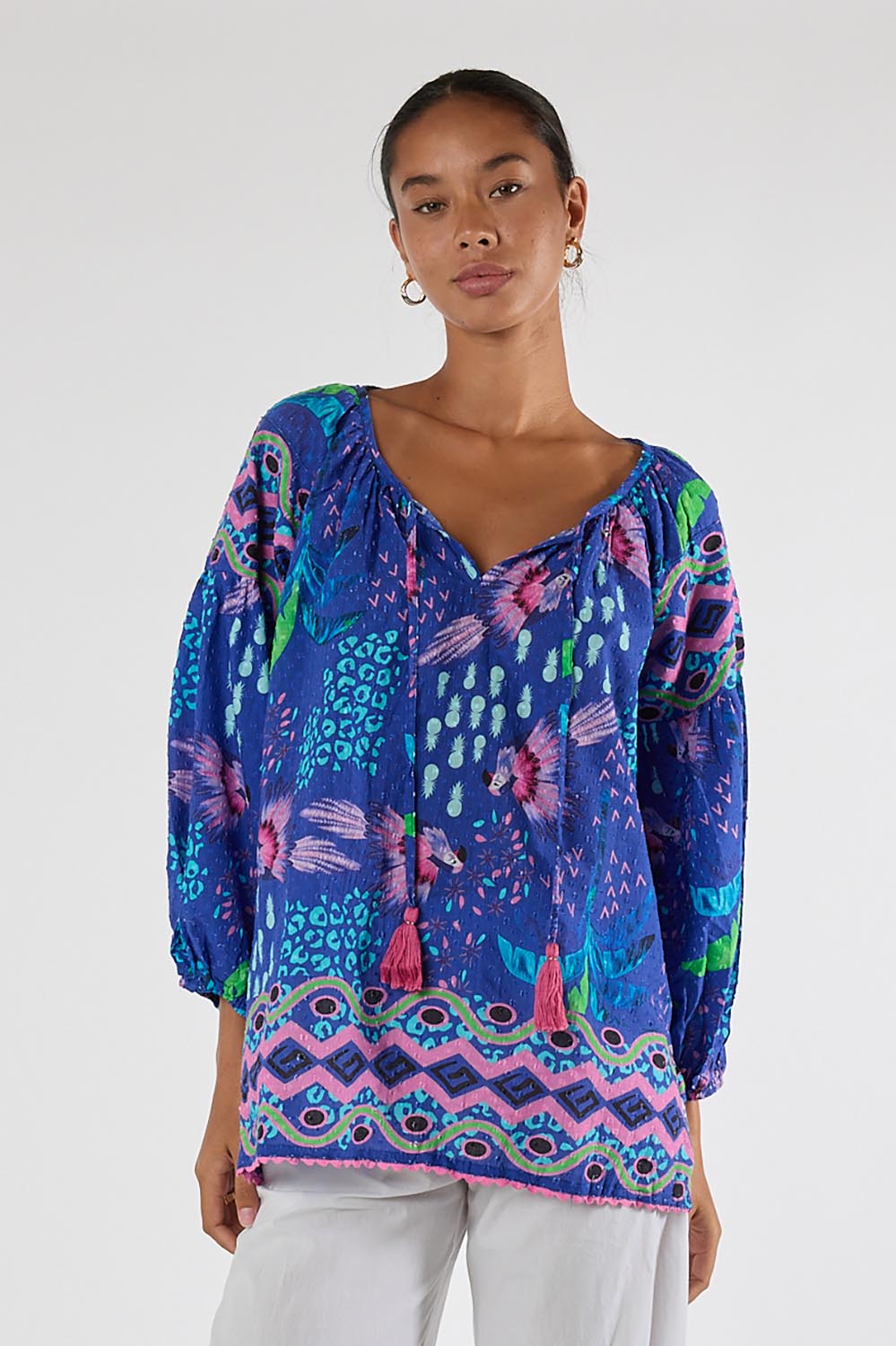 Model Genericm wearing size sample of the Yasmin Top – Ocean in colour Ocean, in a cropped view