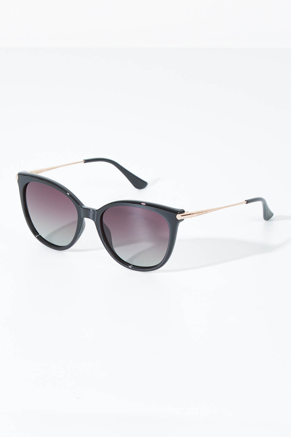 A model wearing size OneSize of the Ashley Sunglasses in colour Black (Black), from the front, showing the whole outfit