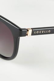 A model wearing size OneSize of the Bella Sunglasses in colour Black (Black), from the front, showing the whole outfit