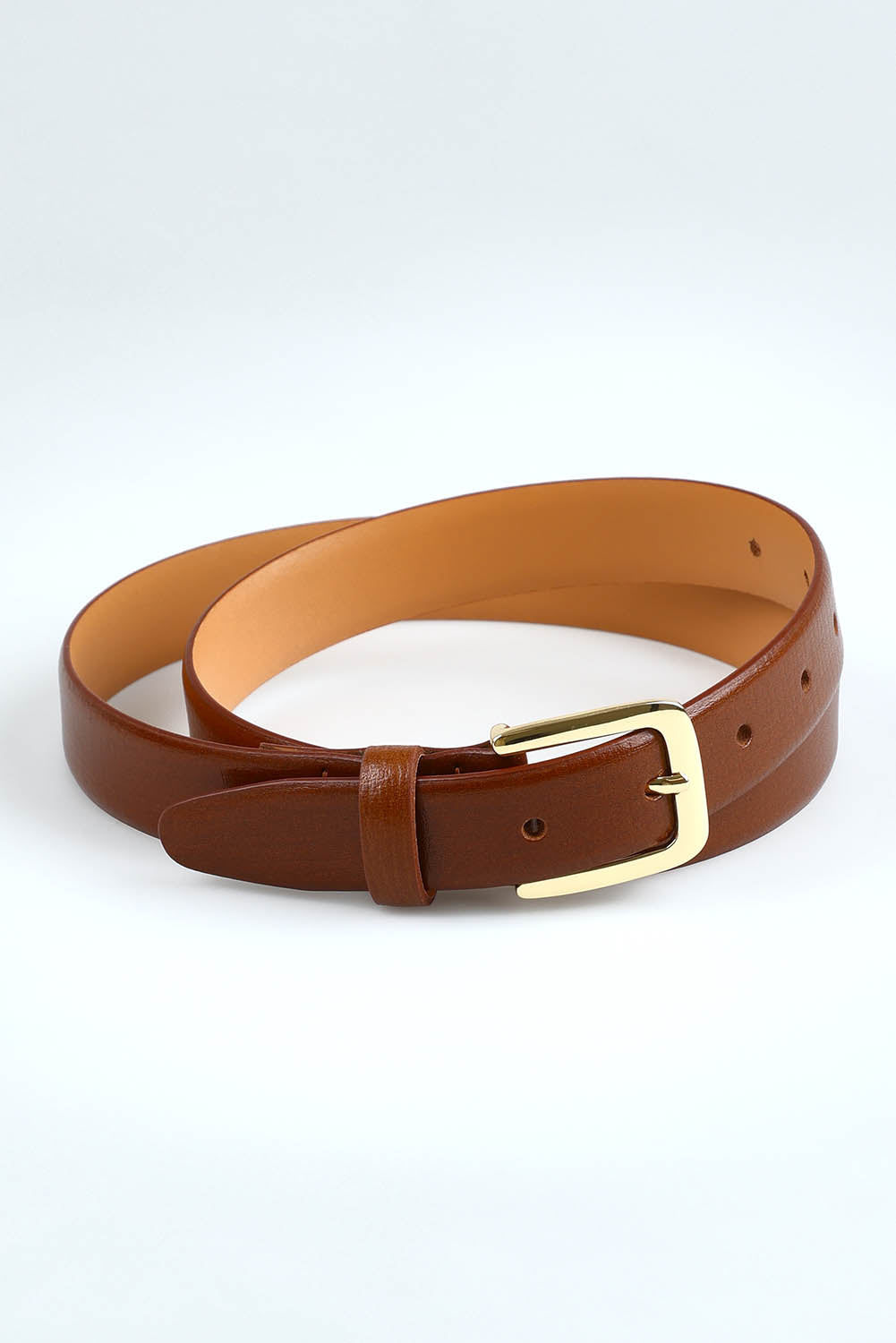 A model wearing size S of the Bliss Leather Belt in colour Tan, from the front, showing the whole outfit