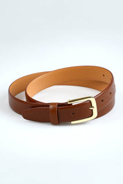 A model wearing size S of the Bliss Leather Belt in colour Tan, from the front, showing the whole outfit