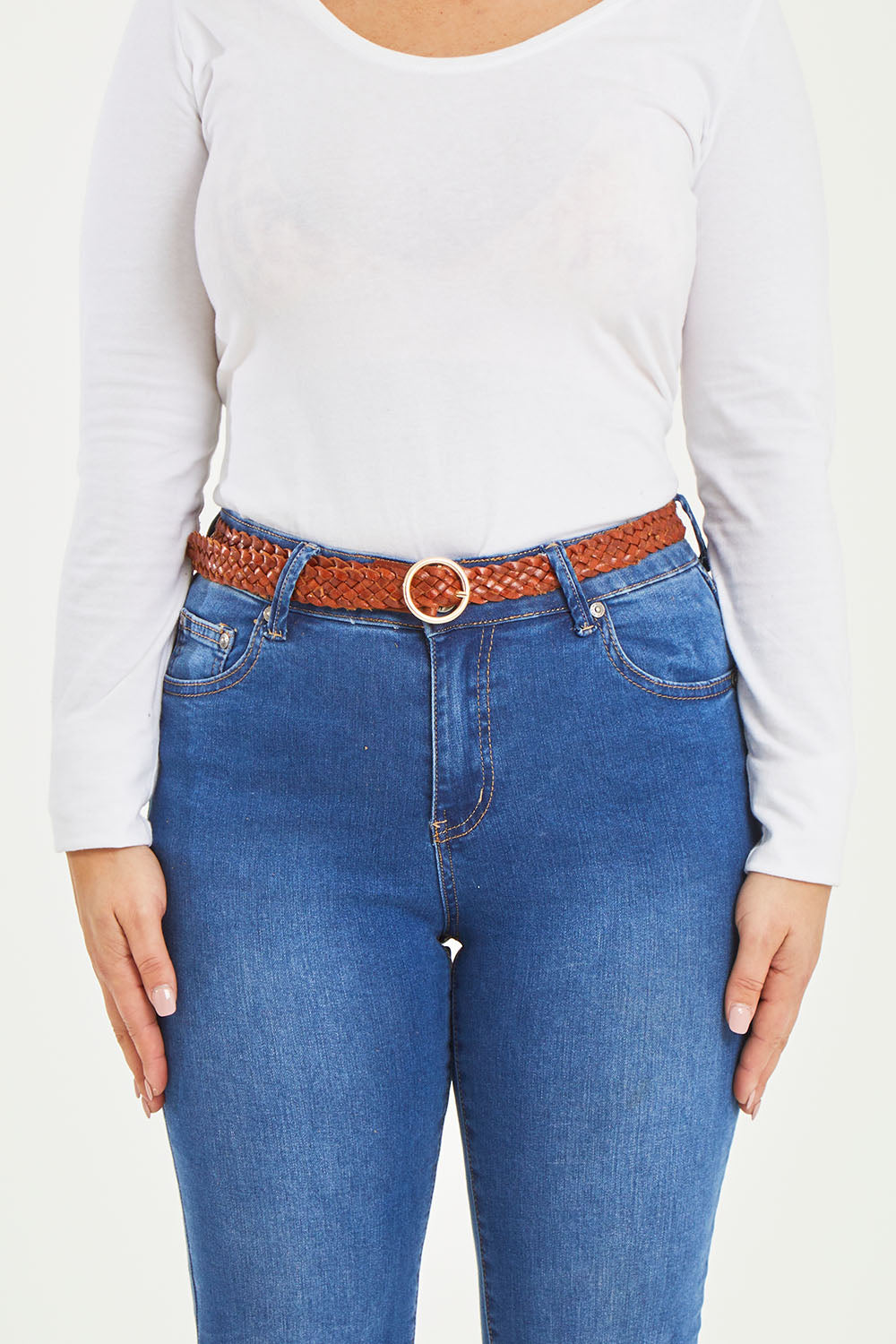 A model wearing size S of the Catrina Woven Leather Belt in colour Tan, from the front, cropped image